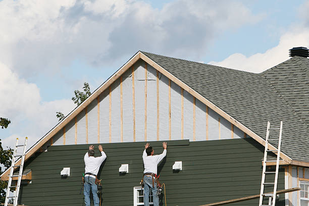 Professional Storm Damage Siding Repair technician working in Sharon Center, OH